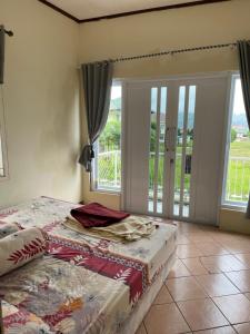 Postel nebo postele na pokoji v ubytování Diana Puncak resort