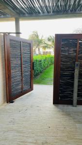 an open door to a building with a gate at Cartagena, Morros Zoe apto acceso directo a playa in Cartagena de Indias