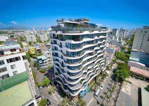 an overhead view of a tall building in a city at Golden Lotus Grand in Da Nang