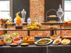 a buffet with many different types of food on a table at Kurashiki Ivy Square in Kurashiki