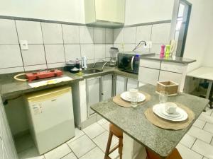 Η κουζίνα ή μικρή κουζίνα στο Apart Cavalari Kitnets