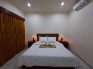 Postel nebo postele na pokoji v ubytování Guest House Sudara