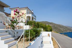 a house on the side of a hill with stairs at Nefeles Arkadiko Chorio in rkadiko Chorio