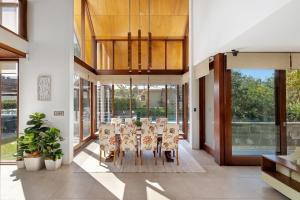 a dining room with a table and chairs at Kingscliff Balinese Beachfront Retreat in Kingscliff