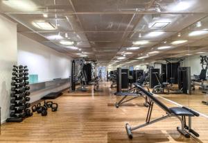a gym with a lot of treadmills and machines at 1318 - Rentaqui Studio Frei Caneca Premium in Sao Paulo