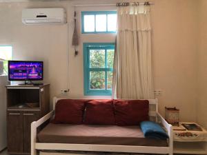 TV a/nebo společenská místnost v ubytování Paikea Hostel Praia do Rosa