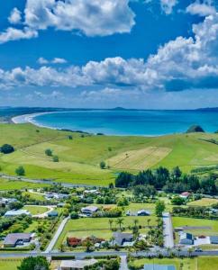 an aerial view of a town next to the ocean at Taipa Views Bed & Breakfast in Kaitaia