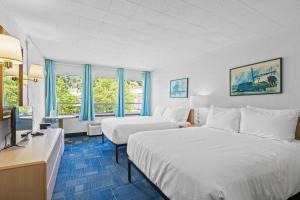 Ένα ή περισσότερα κρεβάτια σε δωμάτιο στο Stardust Motel Wallace