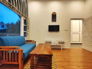 Μια τηλεόραση ή/και κέντρο ψυχαγωγίας στο BAGO Harmony Home - A Boutique Villa