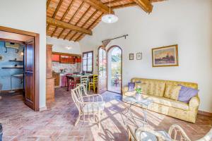 a living room with a couch and a table at Agriturismo Maramaldo in Castelfiorentino