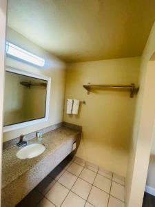 a bathroom with a sink and a mirror at Happy Smart Inn I-10 Eloy and Casa Grande in Eloy