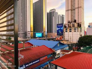 a view of a city with tall buildings at Jenny N Rose Travellers Inn in Manila