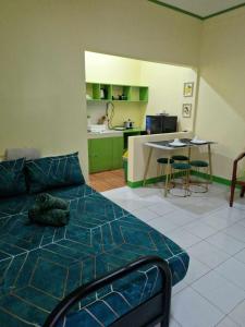 Ένα ή περισσότερα κρεβάτια σε δωμάτιο στο Waray WaRaE Haven