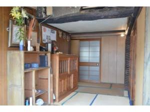 a room with a garage with a door in it at Tsukubo-gun - House / Vacation STAY 34603 in Hayashima