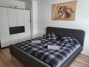 a bed with two pillows on it in a bedroom at Exclusivwohnung Hohenmölsen in Hohenmölsen