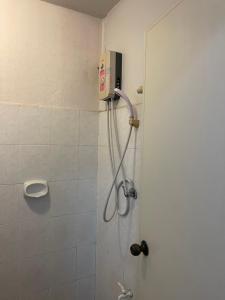 a bathroom with a shower with a shower at JJ Guesthouse in Chiang Mai +49 photos