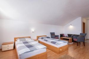 Ein Bett oder Betten in einem Zimmer der Unterkunft Pension Lunatyk