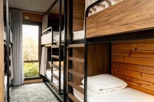 a bedroom with bunk beds in a house at Haka House Aoraki Mt Cook in Mount Cook Village