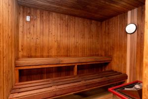 a wooden sauna with a wooden bench in it at Haka House Aoraki Mt Cook in Mount Cook Village