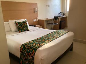 Adis Hotels Ibadan客房内的一张或多张床位