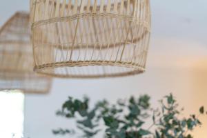 a light fixture hanging from the ceiling of a room at Surf Lodge Avoca Beach Waterfront to Avoca Lake in Avoca Beach