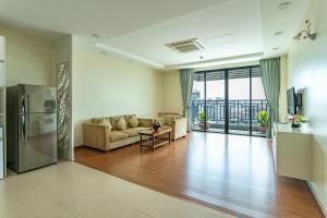 a living room with a couch and a table at ANINA Office & Serviced Apartments in Phnom Penh