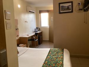 Adis Hotels Ibadan客房内的一张或多张床位