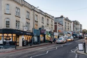 a busy city street with cars parked on the street at Redland Place - Your Apartment in Bristol