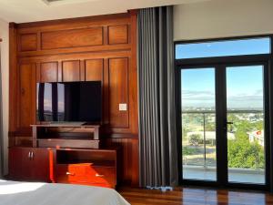 TV a/nebo společenská místnost v ubytování Đoàn Gia Luxury House + 6 fotografií