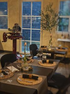 a table with glasses and plates of food on it at Amical Hotel in Wuppertal