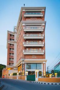 un edificio con un cartello sul lato di Hotel Ambassador by ACE Hotels a Kathmandu