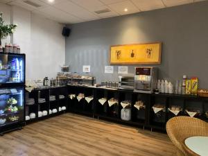 a store with a counter with food on display at Hotel Villasegura in Molina de Segura