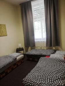 Ein Bett oder Betten in einem Zimmer der Unterkunft Apartmány Elisabeth