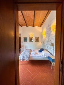 a bedroom with a bed in a room at Tenuta Massabò in San Casciano in Val di Pesa +131 photos