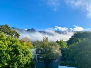 a view of the mountains with clouds in the sky at The View Swellendam B&B in Swellendam