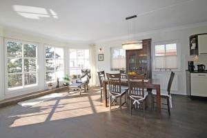 a kitchen and dining room with a table and chairs at Villa Katharina in Kühlungsborn