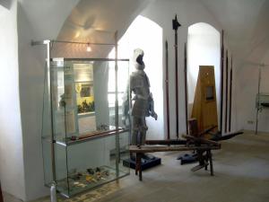 a statue of a man in a glass case in a museum at Herberge Burg Hohnstein in Hohnstein