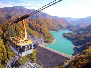 a gondola flying over a river in a valley at Naeba Prince Hotel in Yuzawa +162 photos