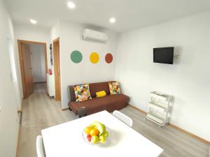a living room with a couch and a table at Herama House in Vila Nova de Gaia