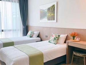 Sand Dance Hotel客房内的一张或多张床位