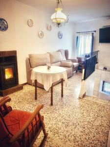 a living room with a couch and a table at Casa Boneta Alpujarra Almeria-Alboloduy in Almería