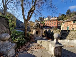 a small building on a hill next to a river at Holiday stay by Federica - Casetta Mami alle terme in Mele
