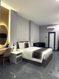 Postel nebo postele na pokoji v ubytování LION 9 HOTEL