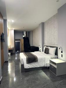Postel nebo postele na pokoji v ubytování LION 9 HOTEL