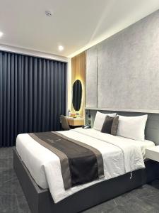 Postel nebo postele na pokoji v ubytování LION 9 HOTEL