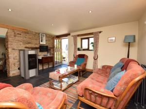 a living room with a red couch and chairs at 2 Bed in Whaley Bridge PK741 in Whaley Bridge