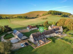 an aerial view of a large house in a field at 3 Bed in Melbury Abbas 48804 in Melbury Abbas