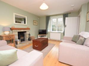 a living room with two couches and a fireplace at 2 bed in Duns 48811 in Duns