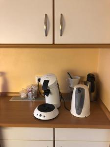 a kitchen counter with a coffee maker and a toaster at Haus Bergglück in Hückelhoven