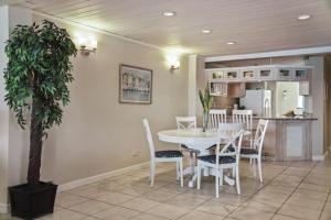 a dining room and kitchen with a table and chairs at The Harbour #6 - 2 Bedrooms in Rodney Bay townhouse in Gros Islet